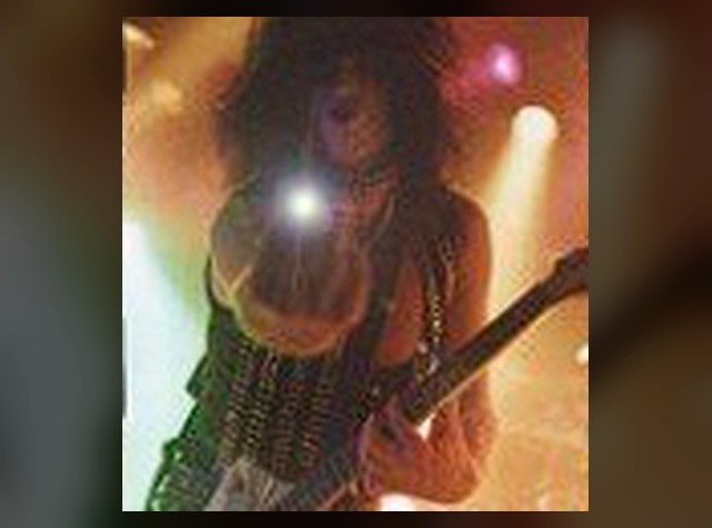 Vintage live performance photo of Benny Doro on guitar