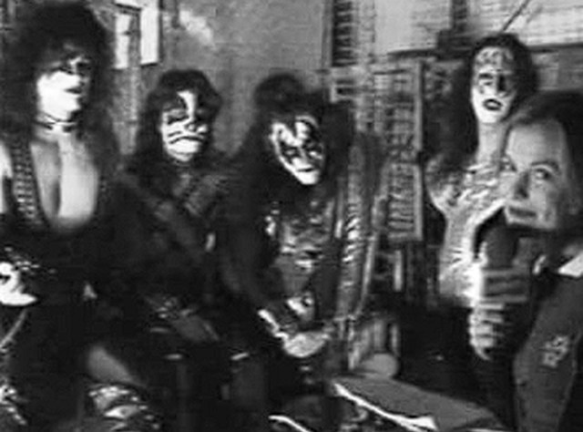 Black and white backstage press photo with KISS