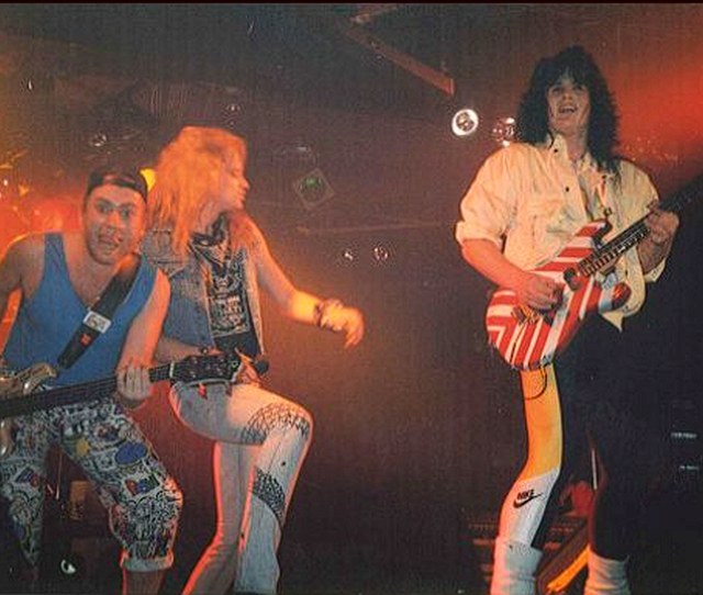 Benny Doro performing on stage with bandmates